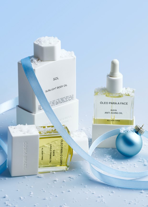 Body and face oils with a blue ribbon and bauble